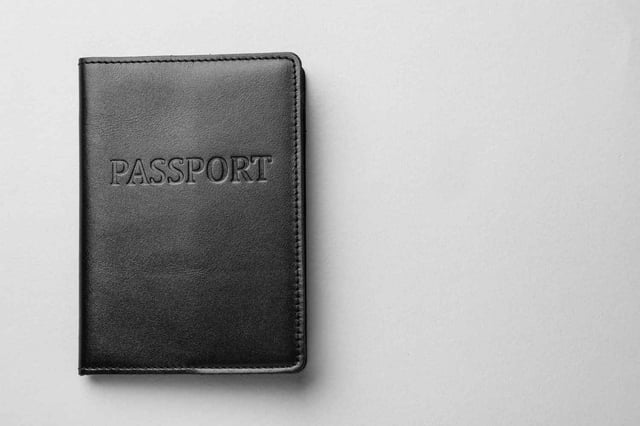A Passport On A Light Grey Background