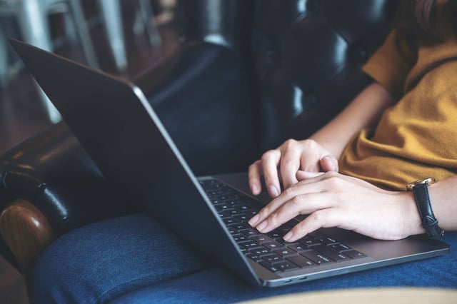 A Person Using A Laptop