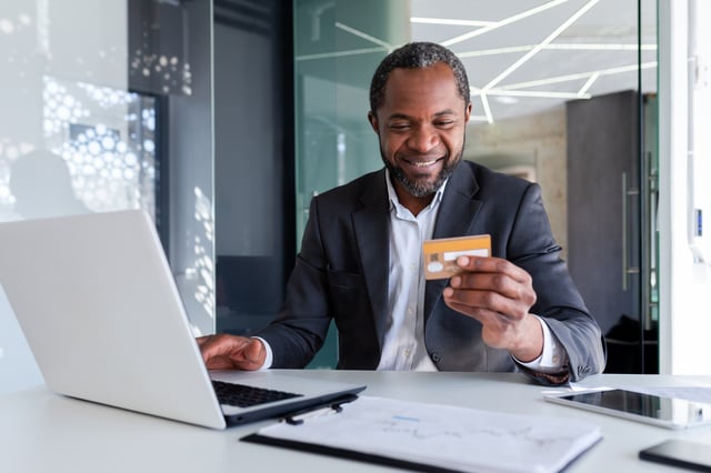 Laptop And Holding And Using Credit