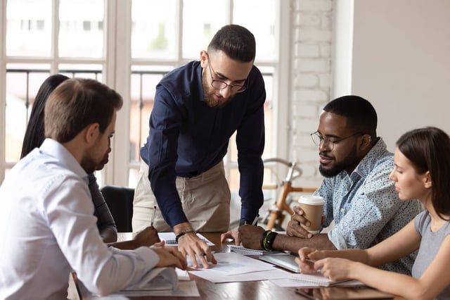 Manager leading a team meeting