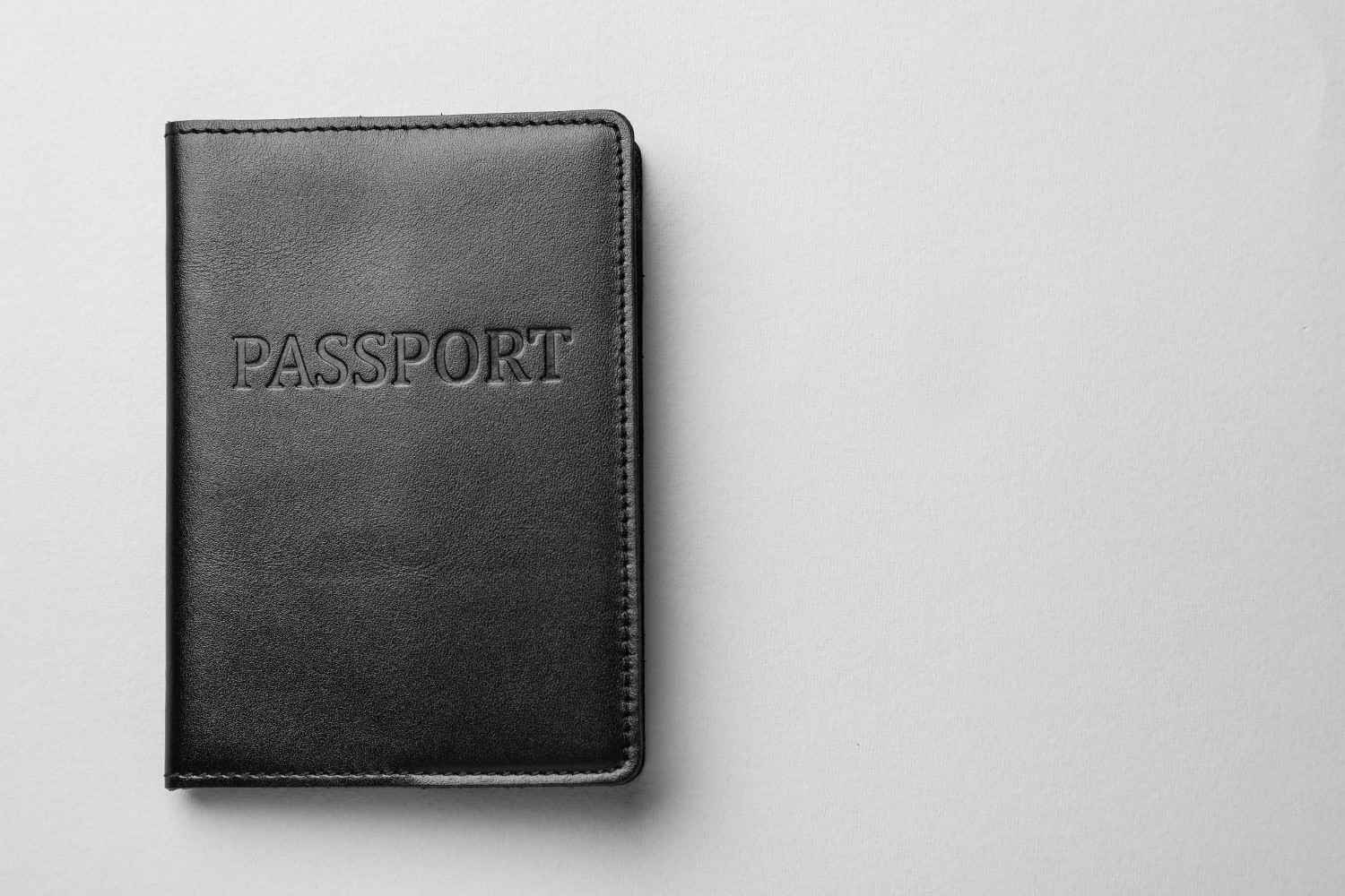A Passport On A Light Grey Background
