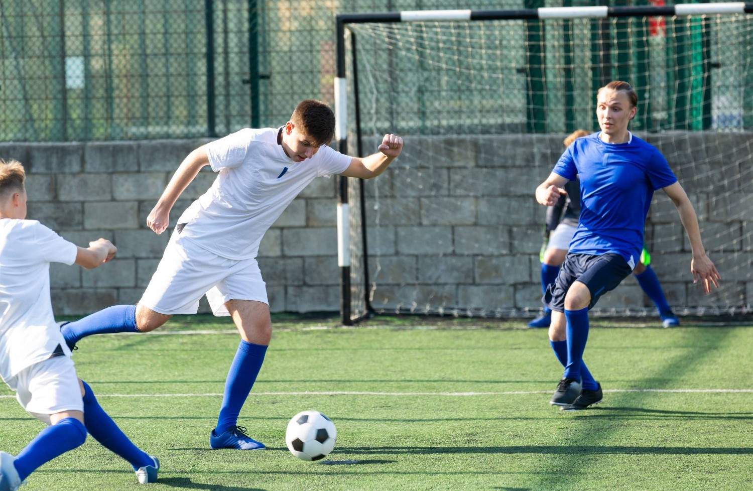 Football Players Battling for Possession in South Africa