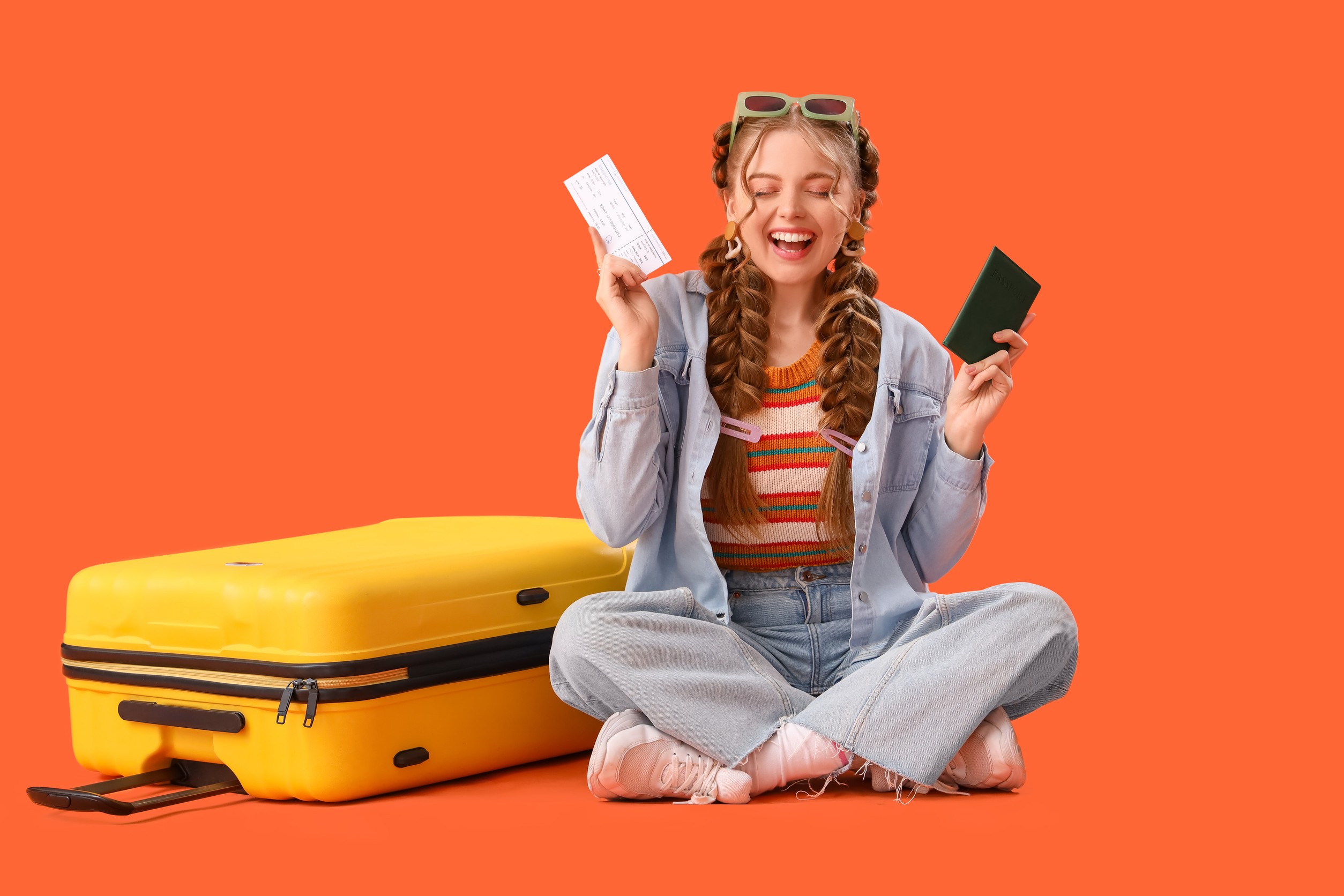Happy Smiling Young Woman with Braids Holding Passport and Ticket Happy Smiling Young Woman with Braids Holding Passport and Ticket